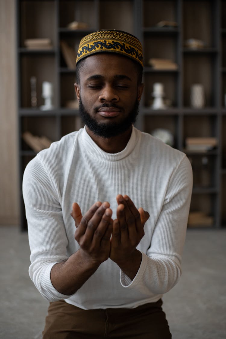 Focused Muslim Black Man Praying At Home