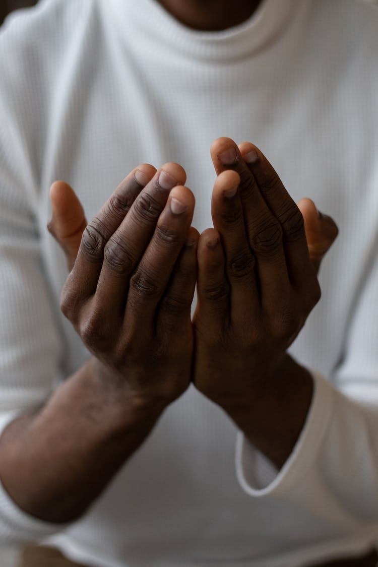 Crop Black Man Showing Pray Gesture