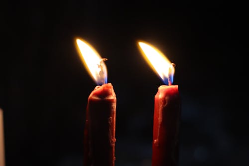 Free Two Red  Lighted Candles Stock Photo