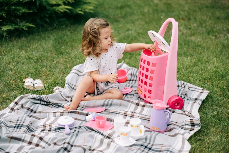 A Young Girl Playing Toys