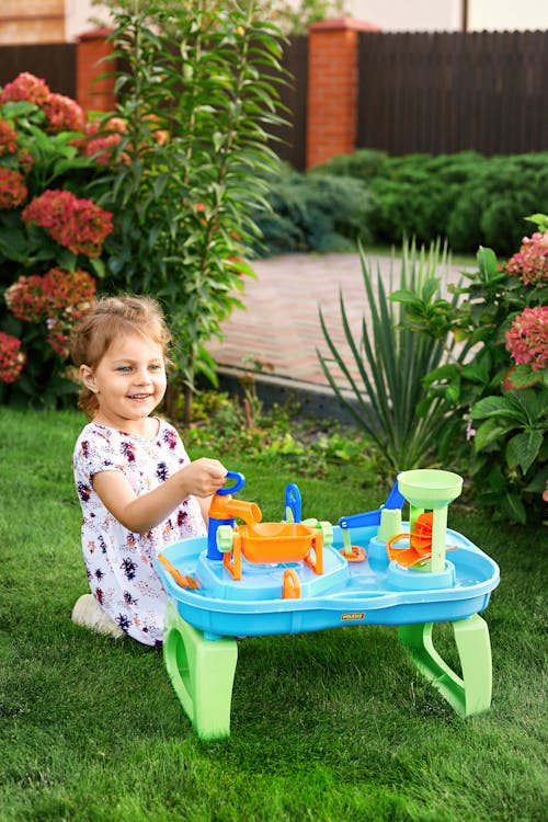 A Young Girl Playing Plastic Toys
