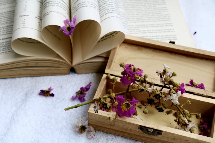 Book And Flowers In A Wooden Box