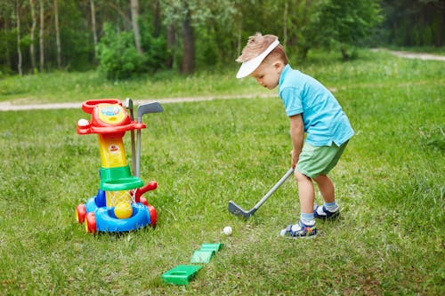 Photo of a Boy Playing Golf