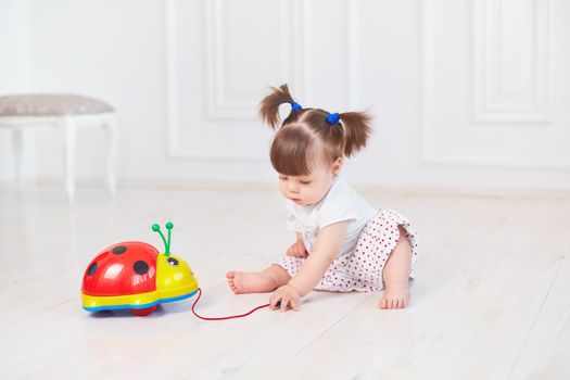 A parent managing a busy toddler daily routine in a living room