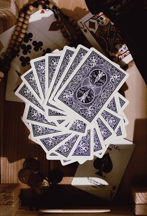 Playing Cards on Wooden Table