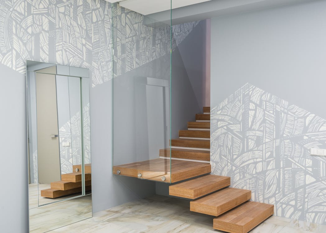 glass staircase handrail with patterned walls