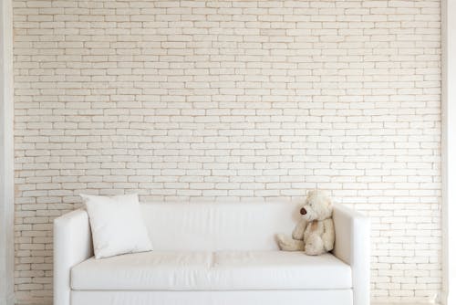 Free Teddy Bear on White Sofa Stock Photo