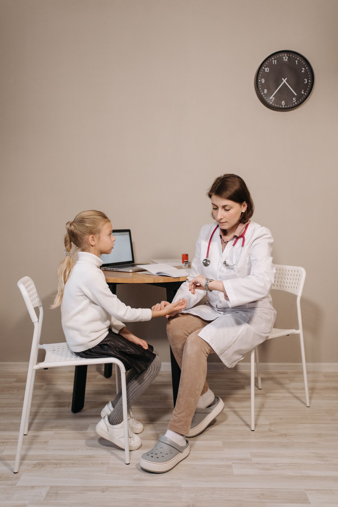 Pediatrician with a young patient