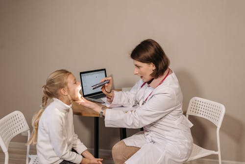 Free A Doctor Examining a Child Patient Stock Photo