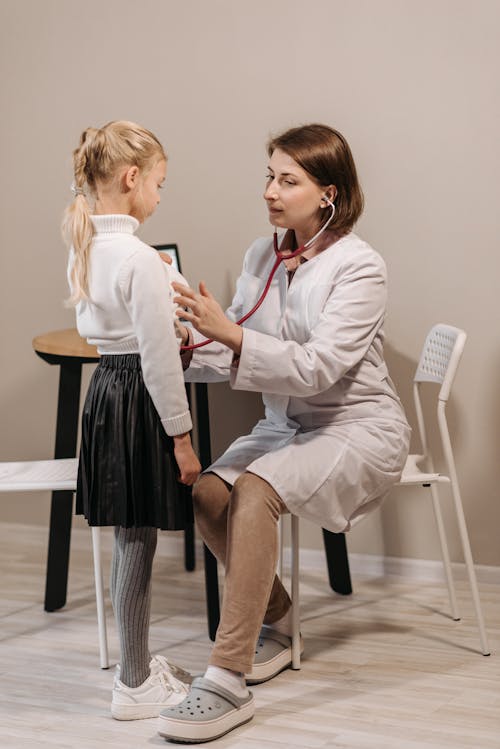 A Doctor Examining a Child Patient