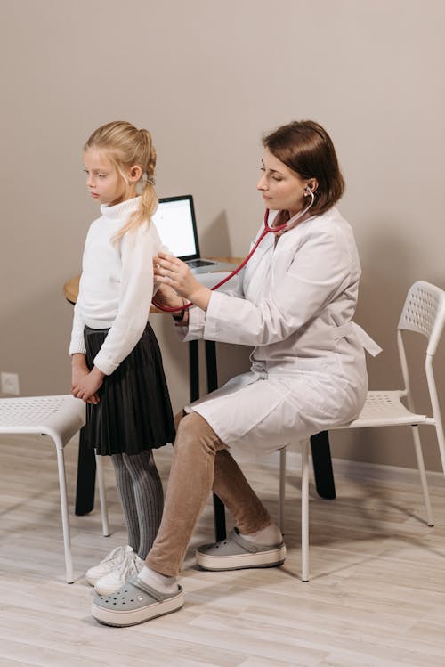 Free A Doctor Examining a Child Patient Stock Photo