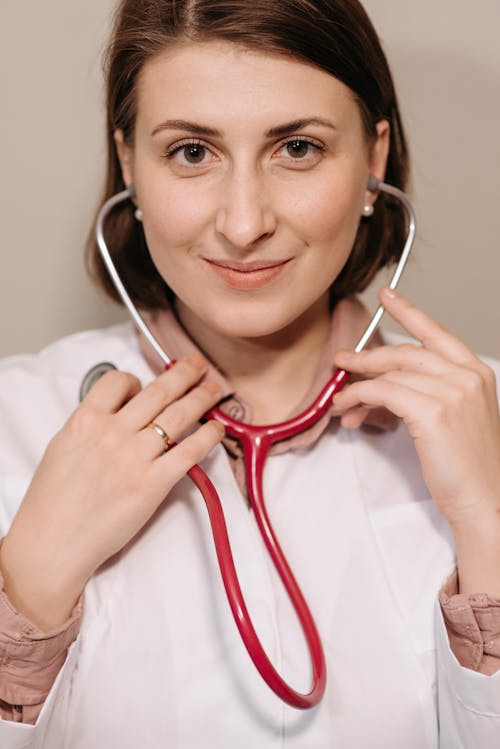 Free Smiling Woman Wearing a Stethoscope Stock Photo
