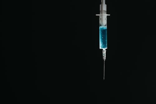 Free Syringe on Black Background Stock Photo