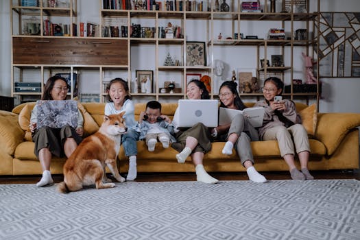 A cheerful family enjoys quality time together with their dog on a cozy living room sofa.