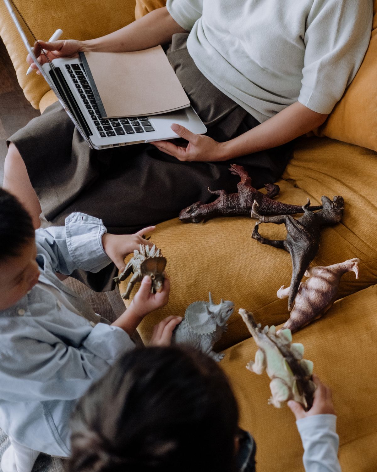 Young boy playing with dinosaur toys for dinosaur crafts for kids