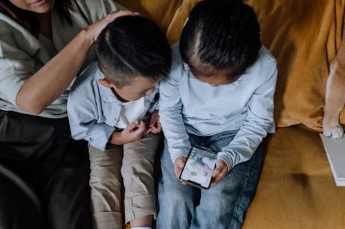 Children Looking at the Screen of Smartphone
