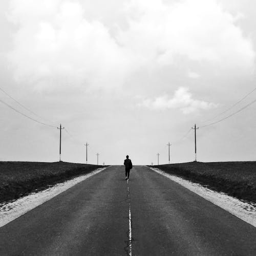 A Person Walking on the Road