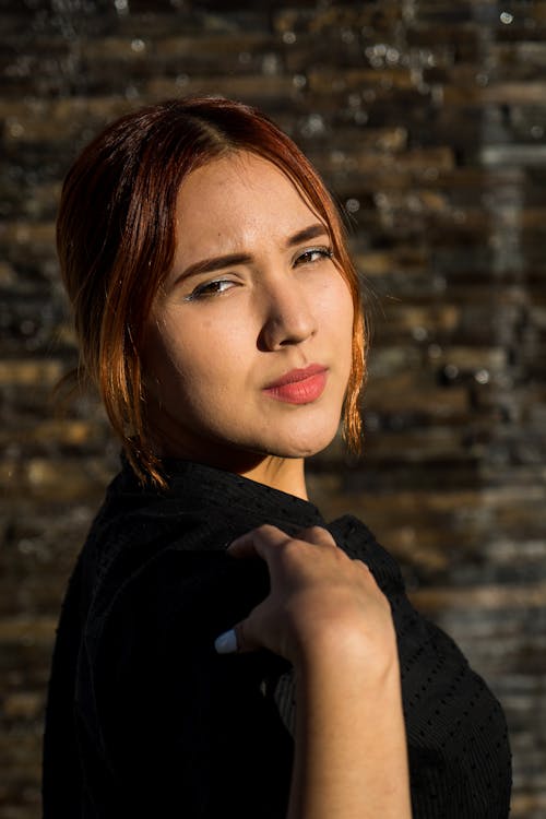 Shallow Focus Photo of Pretty Woman in Black Top