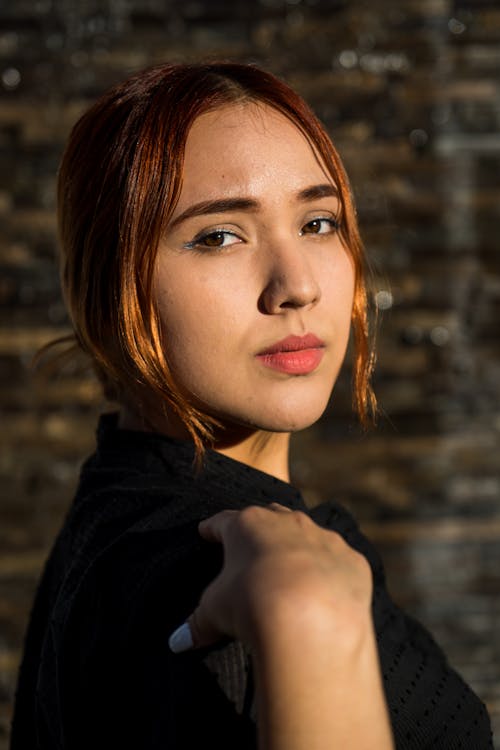 Shallow Focus Photo of Pretty Woman in Black Top