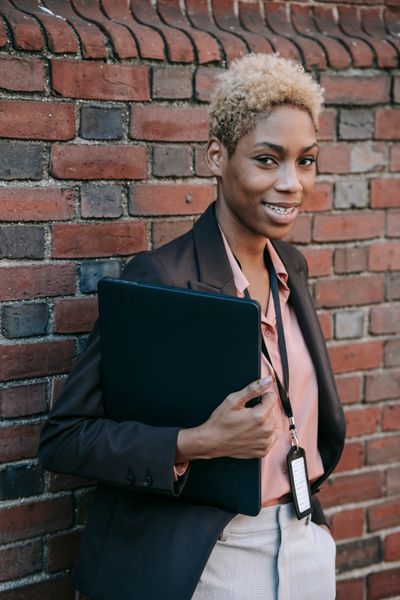 Business owner with a laptop outdoors