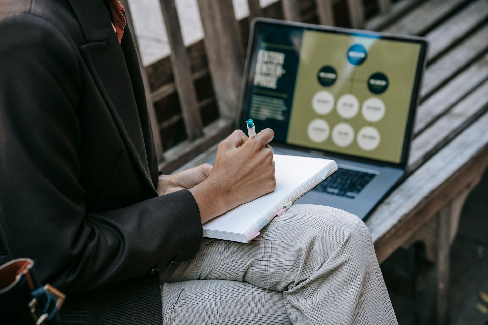 notebook with content distribution strategy and laptop