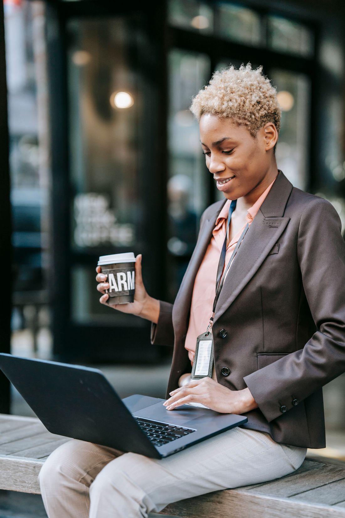 A small business owner checking her website on a laptop