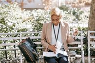 Serious ethnic woman turning documents