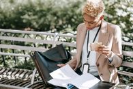 Serious woman looking through documents