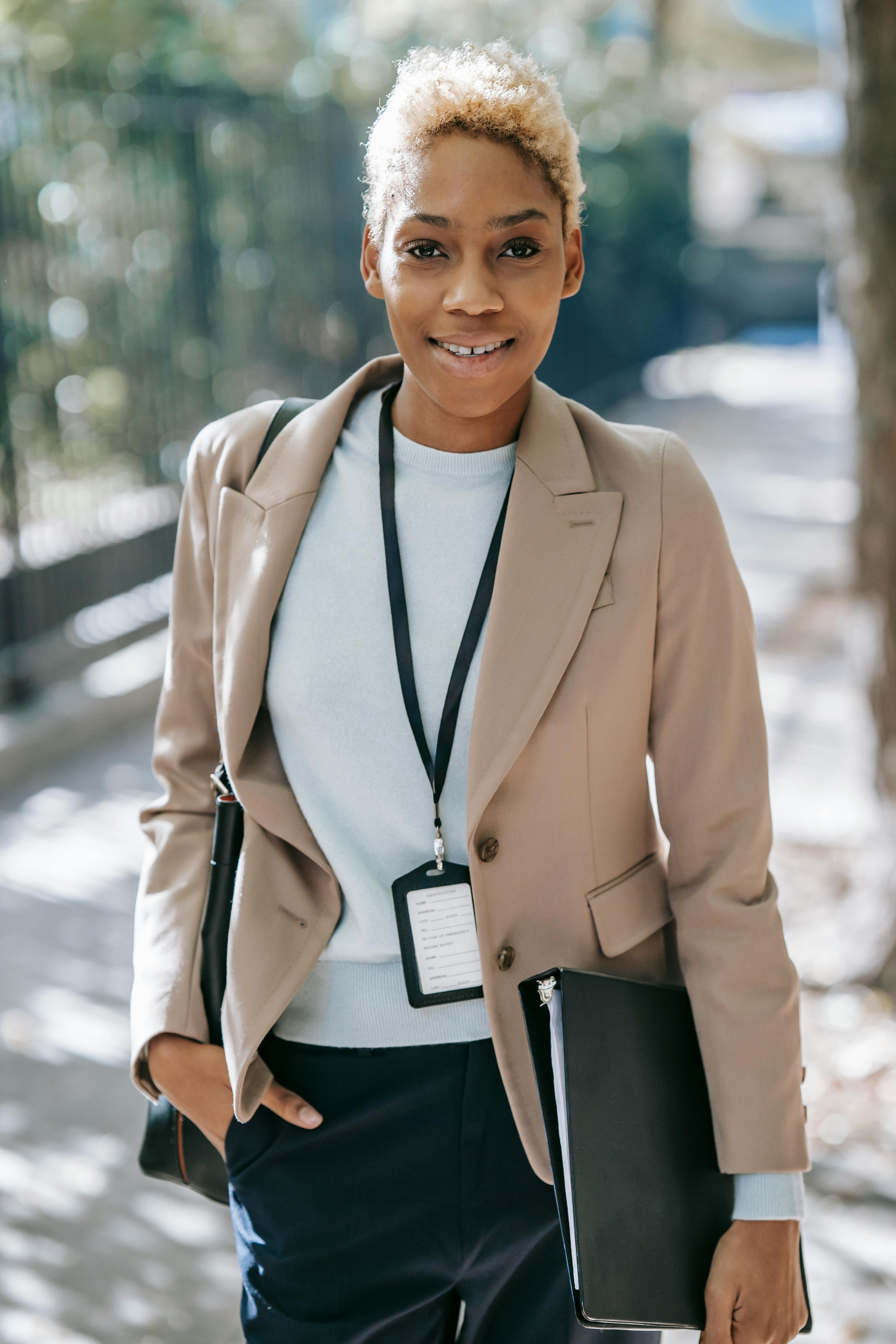 positive ethnic businesswoman looking at camera