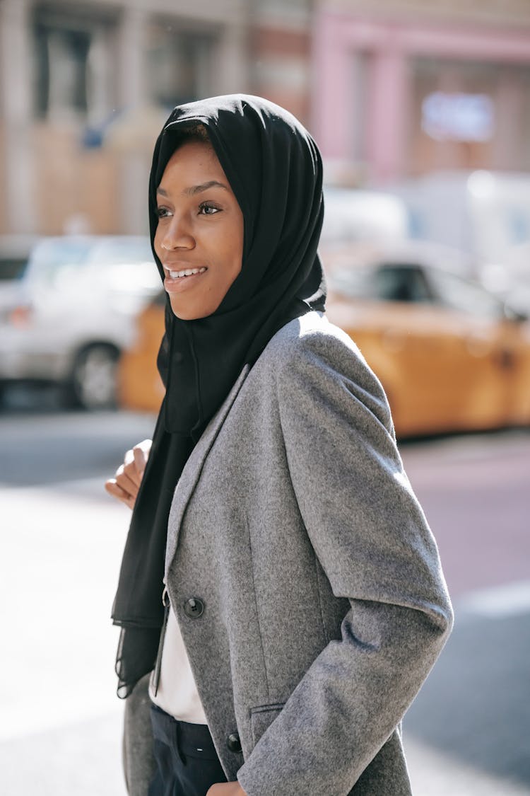 Self Assured Black Muslim Woman Catching Taxi On Street