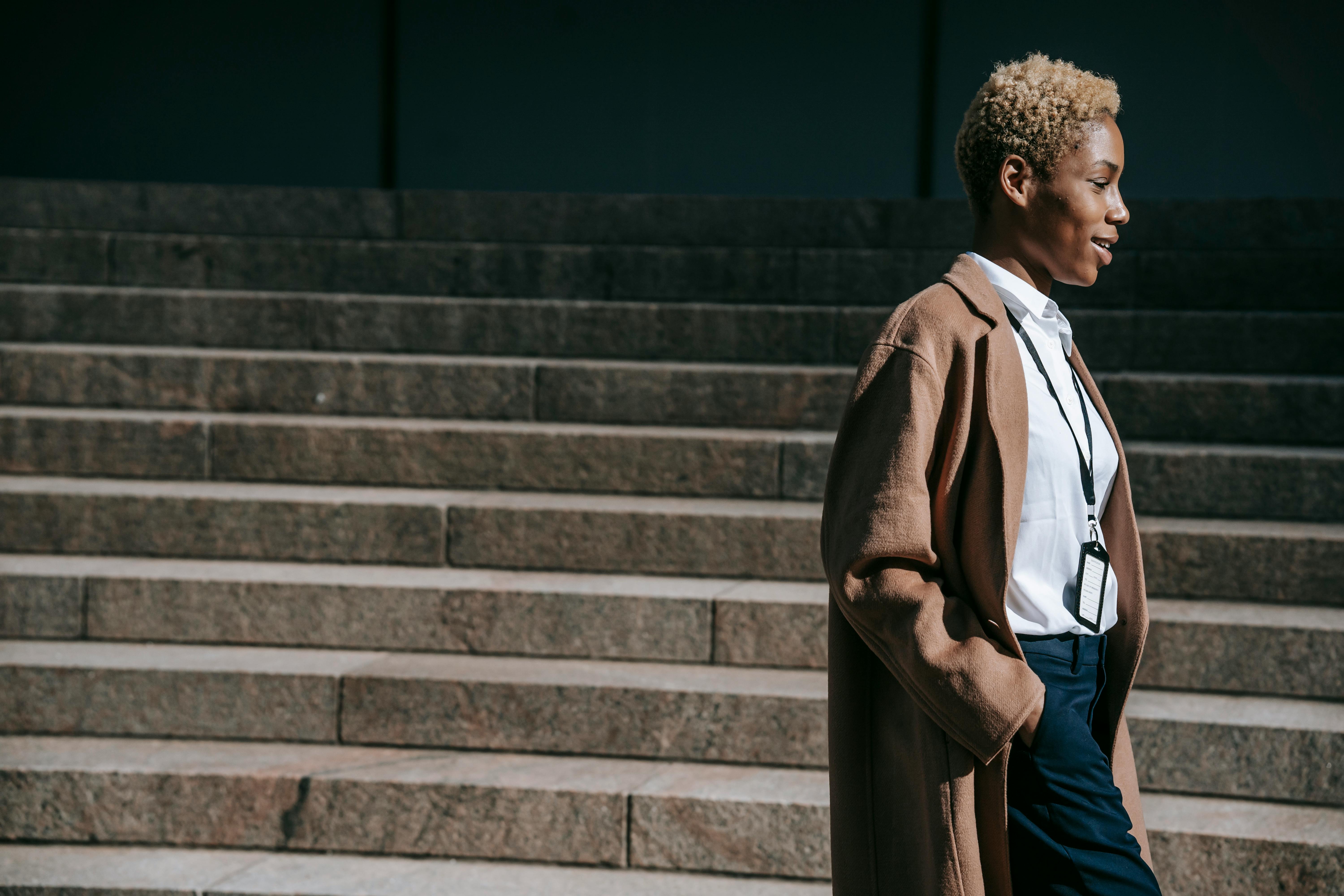 content black businesswoman walking on street