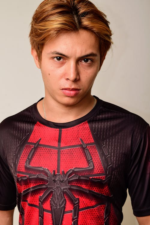 Portrait of Young Man in T-shirt with Spider