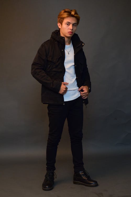 Young Man Posing in a Studio in a Jacket 