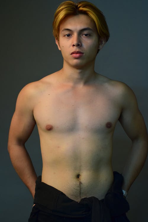 A Shirtless Man Looking at the Camera