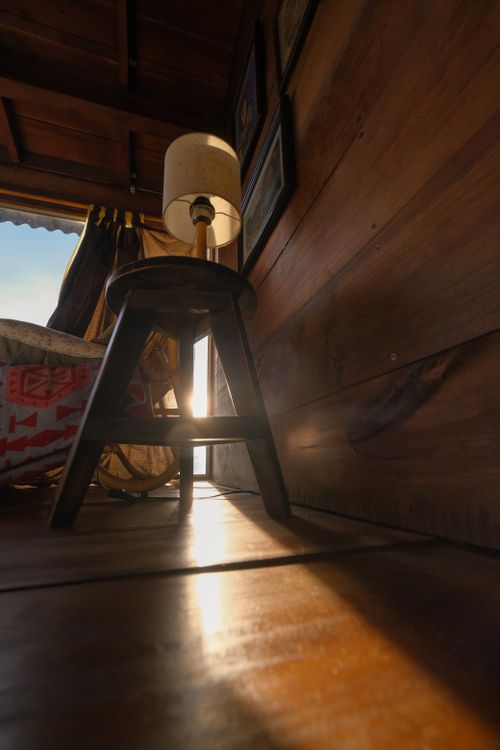 Late light on a timber-lined room — photo by Duong Nhan on Pexels
