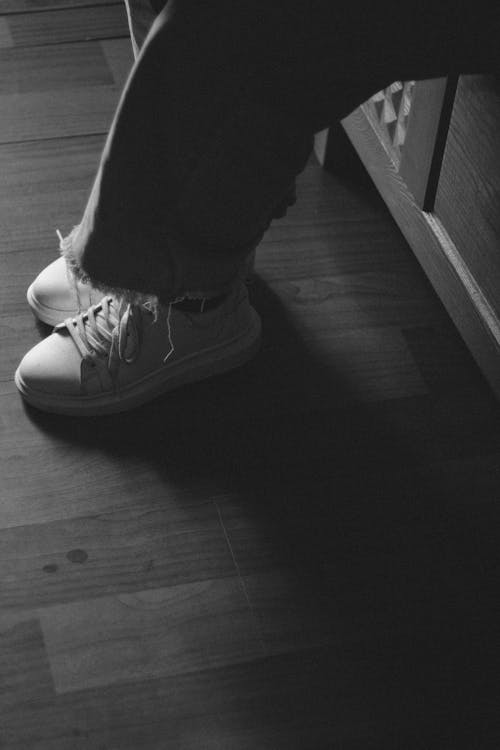 Close-up of Person Legs in Sneakers · Free Stock Photo