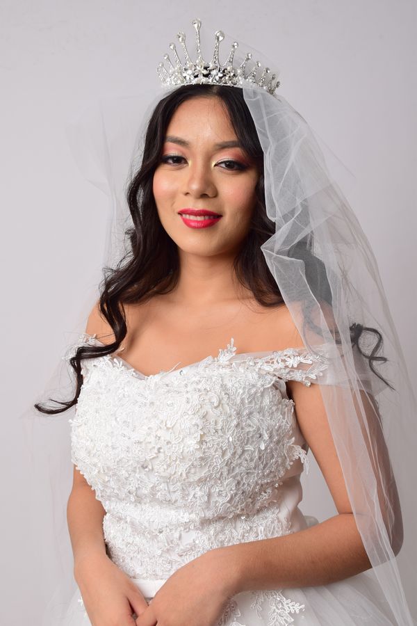 Bride in lace dress with soft bridal makeup