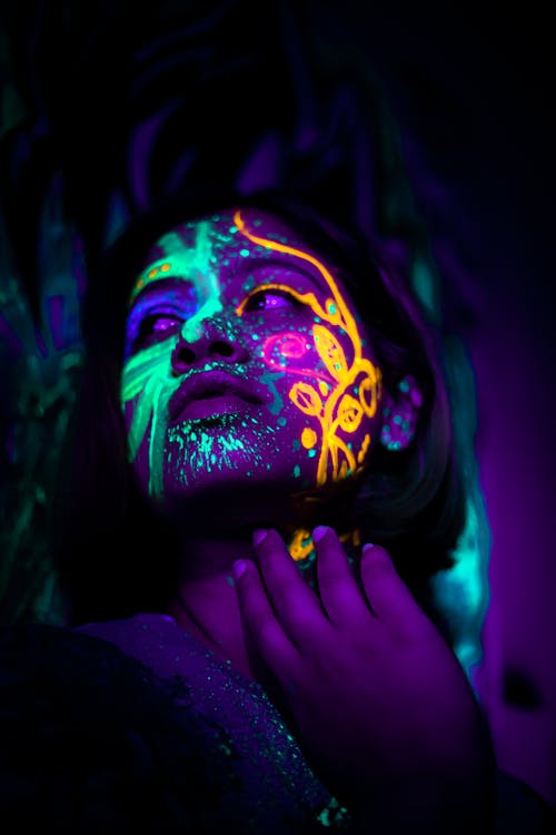 Free A Woman With Neon Face Paint Stock Photo