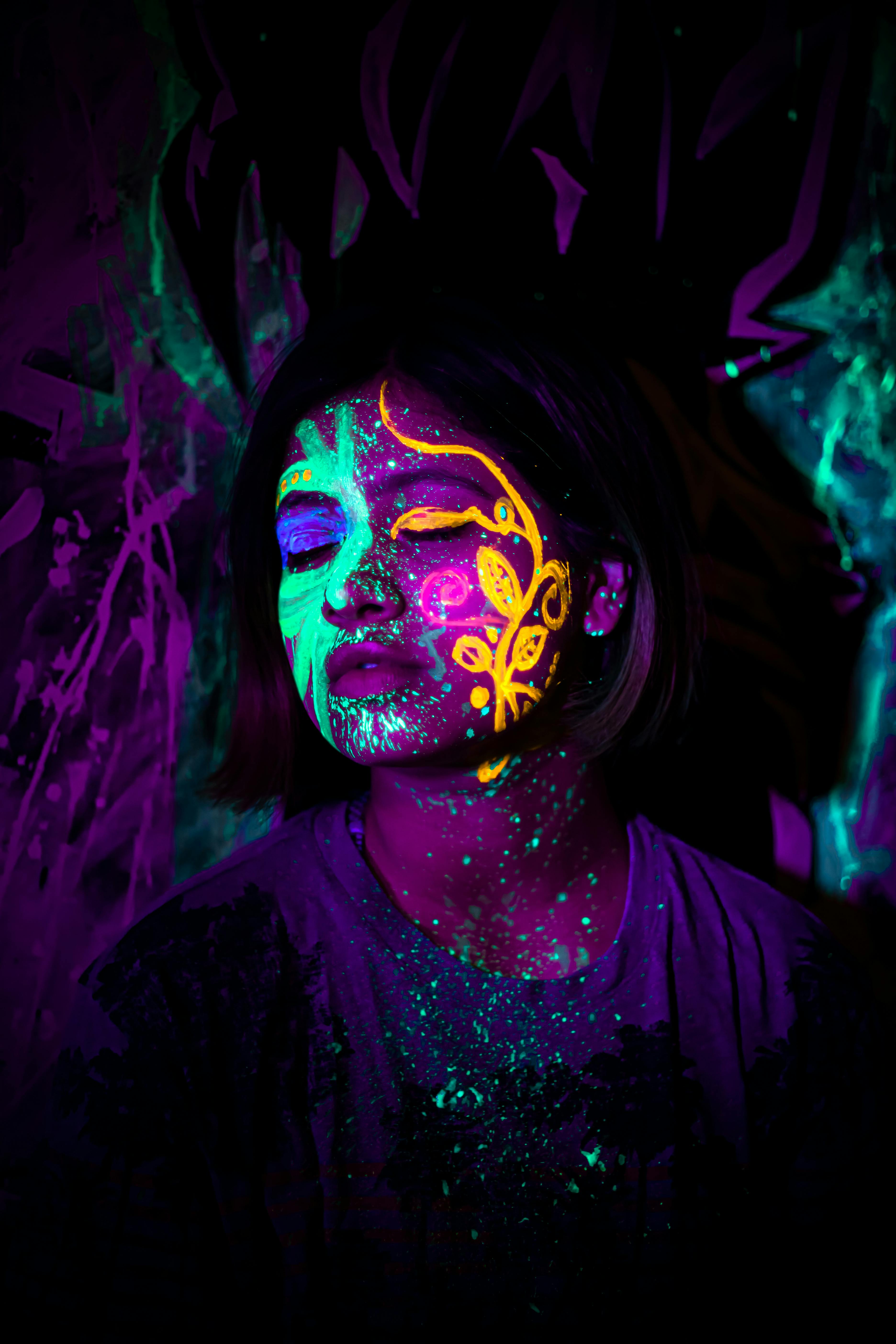 A Woman With Neon Face Paint · Free Stock Photo