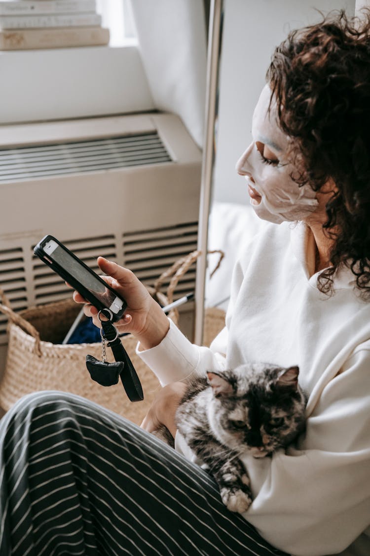 Crop Woman With Cat Browsing Mobile Phone