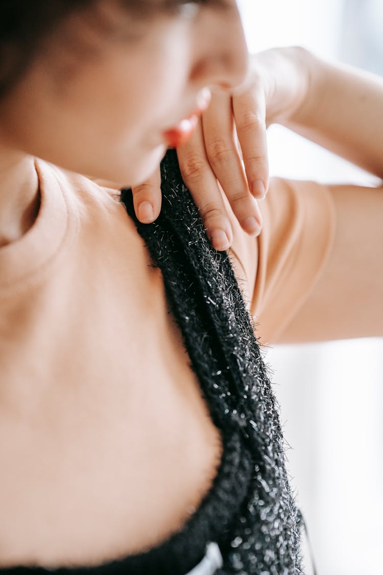 Crop Woman Trying On Wear In Sunlight