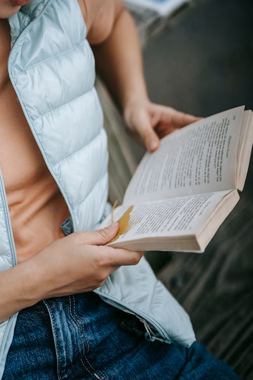 Free Female in casual clothes reading book Stock Photo