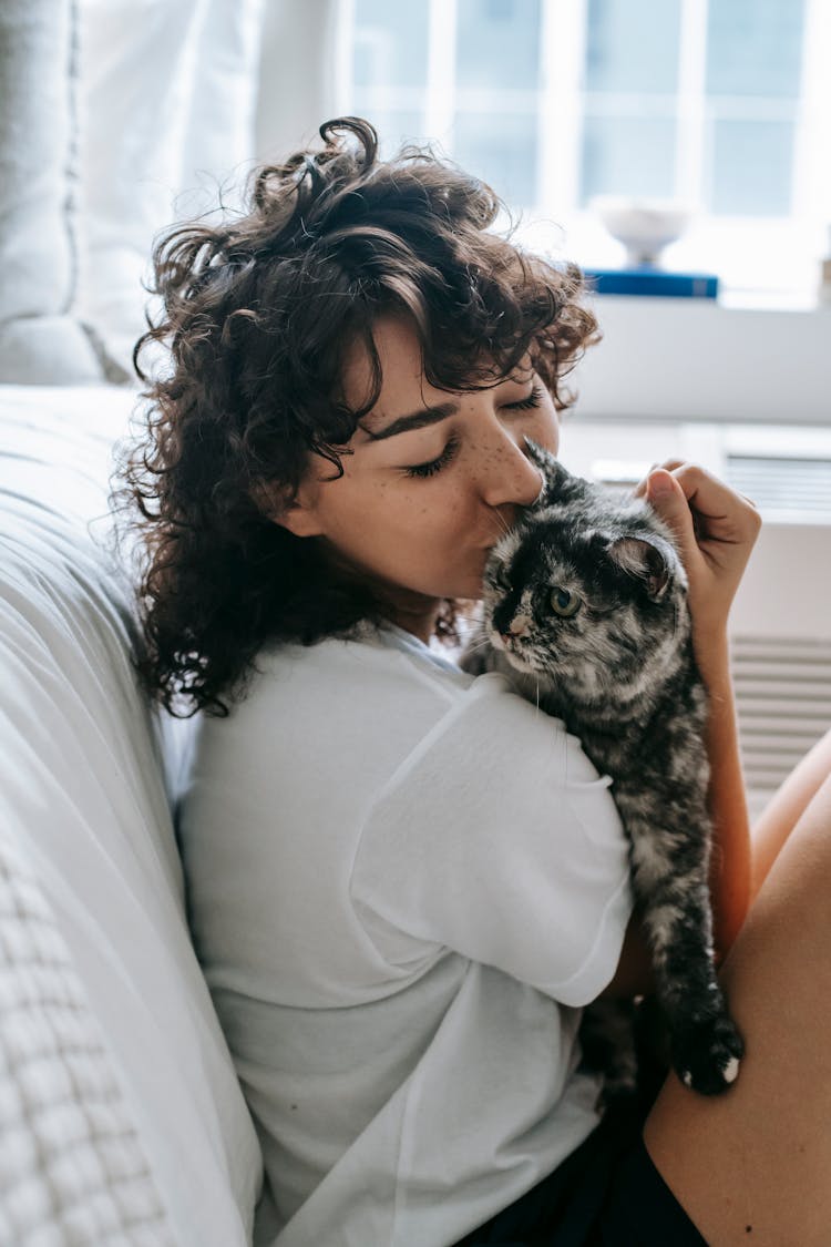 Young Woman With Adorable Cat