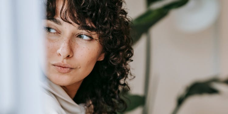 Dreamy Woman Looking Away In Room