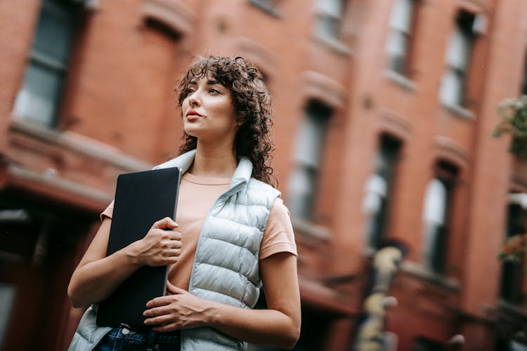 Contemporary Young Woman With Laptop On Street