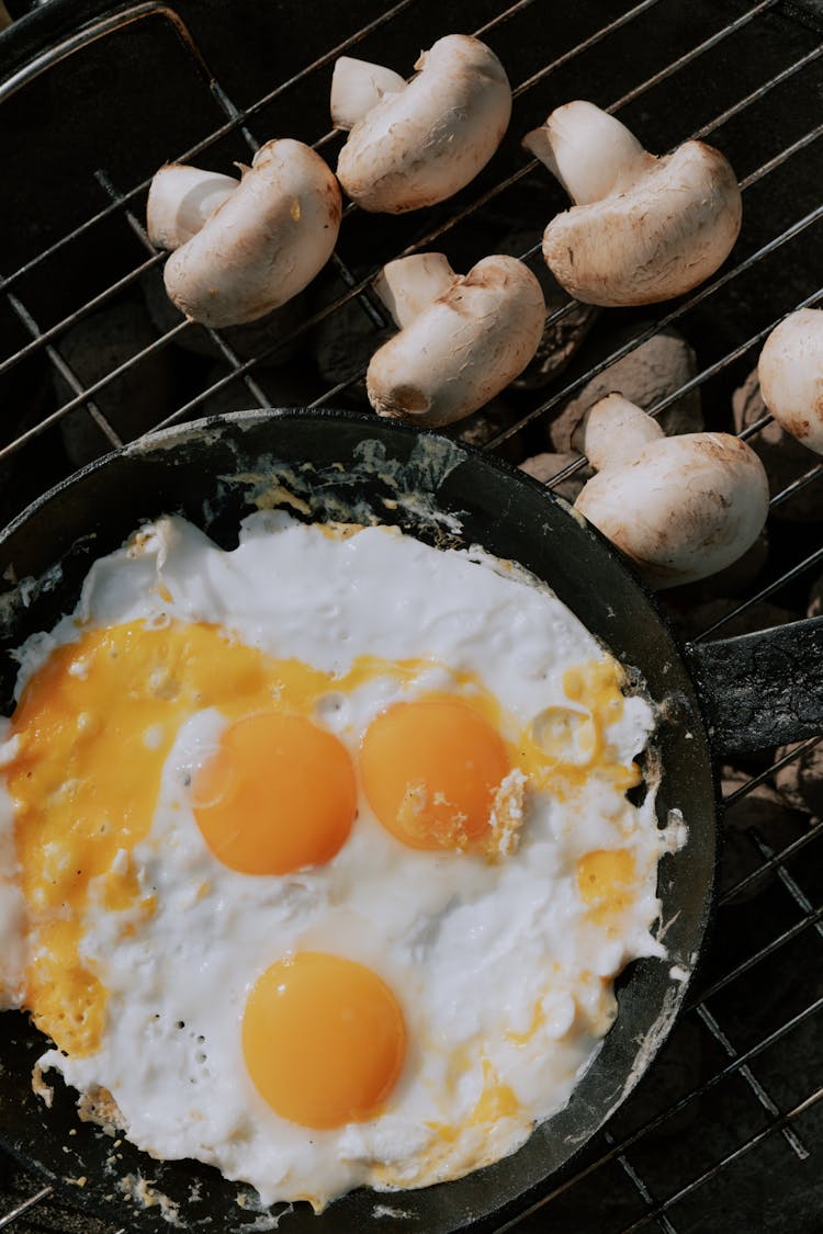 Eggs And Mushrooms On A Grill 