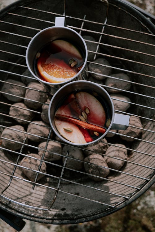 Metal Cups on a Barbecue Grill