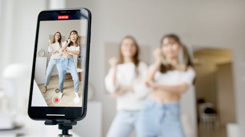 Free Women Recording Using a Smartphone Stock Photo