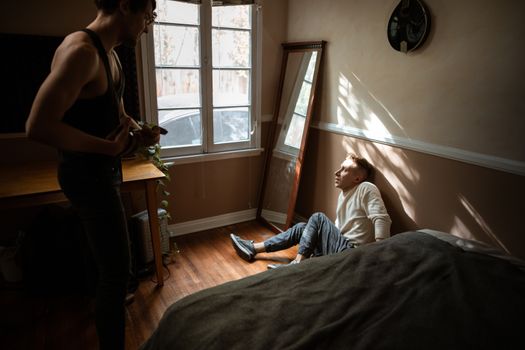 A Scared Man Sitting on the Floor 