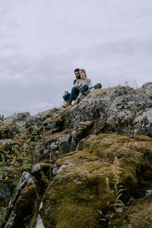 Man and Woman Sitting on a Rock · Free Stock Photo